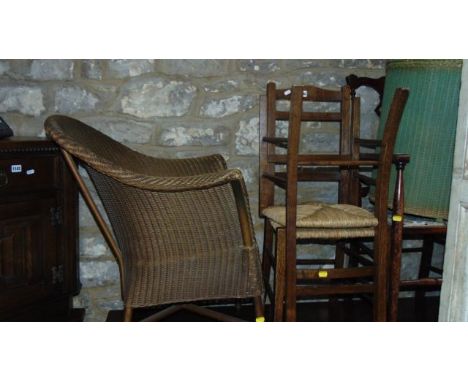 A vintage Lloyd Loom chair with gold painted colourway, a further Lloyd Loom demi-lune linen basket, an Edwardian lightweight