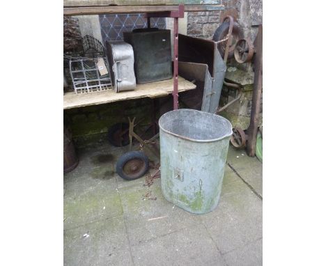 A vintage garden water barrow with iron work frame and galvanised bucket/container together with a galvanised steel wheelbarr