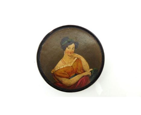 A Georgian papier mache and lacquered snuff box, circular, with hand painted cover of a fashionable young lady