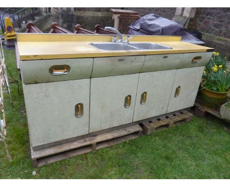 A vintage "English Rose" kitchen twin sink unit, enclosed by four doors and two frieze drawers with original cream painted fi