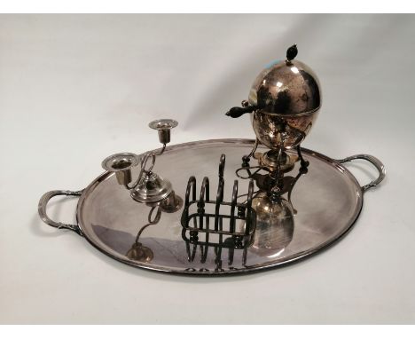 A  20th Century twin handled silver plated tray,  length 57m, together with an ovoid  egg coddler raised on tripod feet, a to