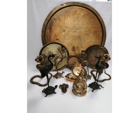 A quantity of 20th Century Asian and Middle Eastern brass and metal ware,  to include a brass pair of crane candlestick holde