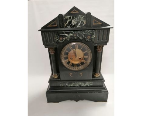 A late 19th Century French slate clock of architectural form,  with Corinthian columns and engraved decoration, the movement 