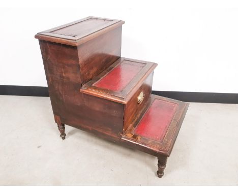 Mahogany leather topped library step,  with central pull out storage compartment.