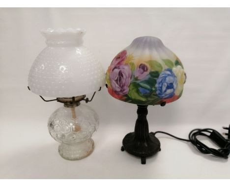 A contemporary lamp with a naturalistic design and a shade decorated with butterflies and flowers,  sold for decorative purpo