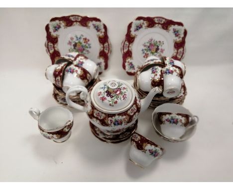 A Royal Standards English bone china tea set for ten in the 'Lady Jane' pattern,  with crimson borders and floral sprigs, con