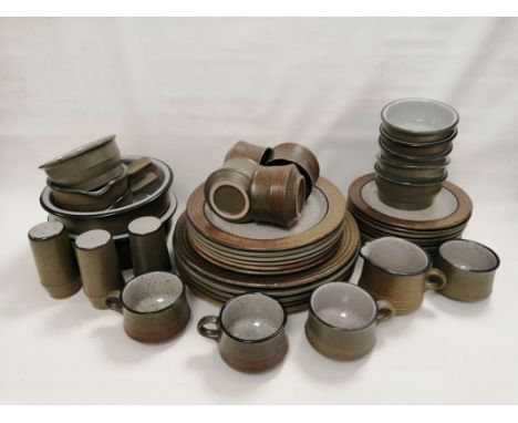 An extensive late 20th Century pottery dinner service,  consisting of eleven dinner plates, two large serving bowls, diameter