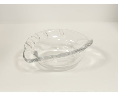 A 20th Century Baccarat glass dish of near oval shape,  with impressions to the rim, the base with factory stamp, diameter 16