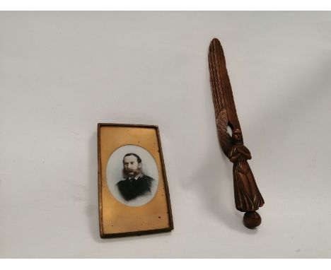 A hardwood page turner in the form of an angel,  possibly olive wood, length 24cm together with a Victorian miniature portrai