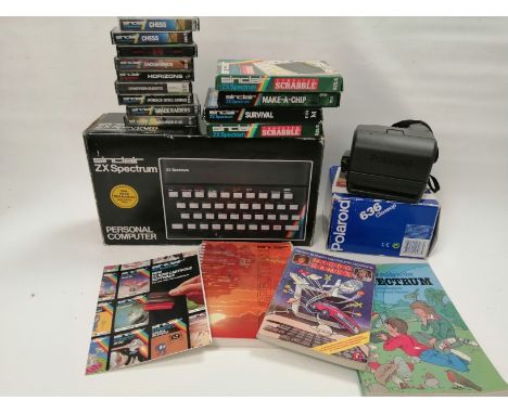 A boxed Sinclair ZX Spectrum Personal Computer,   together with a quantity of boxed and cased programmes and games, to includ