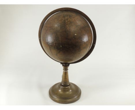 A Victorian terrestrial globe dating between 1840 and 1852, with brass bracket and stand, approximate height 38cm , diameter 