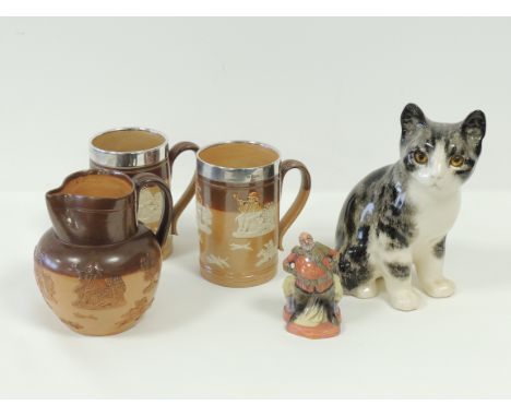 A Winstanley pottery cat,  with characteristic yellow glass eyes, signed 'Winstanley' to base and marked 'made in England 26'