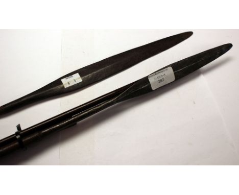 Two 19th Century African short sabbing spears and one arrow with iron tip.