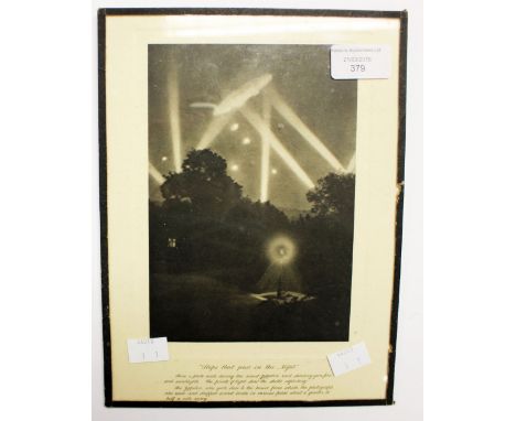WW1 British framed print entitled "Ships that pass in the Night" Shows a Zeppelin captured in searchlights photographed in a 