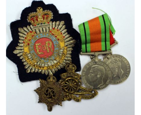 World War Two Medal group to include: Defence Medal, War Medal 1939-45, Royal Artillery cap badge, Royal Army Service Corps c