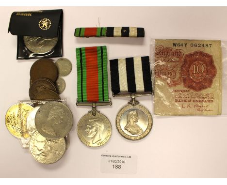 A bag of coins, L.K.OBRIEN ten Shilling banknotes x 2, St Johns Ambulance medal to CPL M HALLAM, DERBY.S.J.A.B. and Defence m