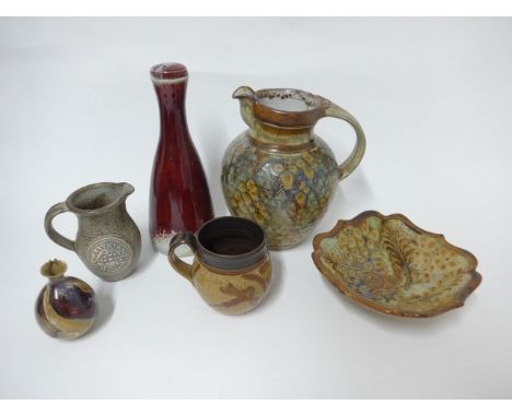 A collection of studio pottery to include John Calver jug and dish, Tony Pugh carafe etc. Tallest 25cm. (6)Crazing on the red