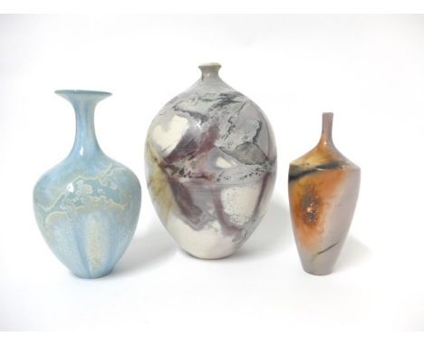 A smoke fired studio pottery vase by Christine Gittins, another by Jane Gibson and an unknown crystaline vase. Tallest 19cm