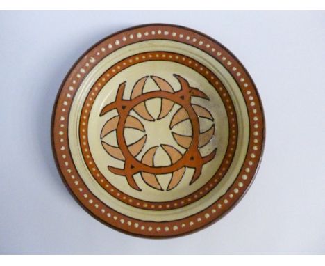 A large studio pottery bowl with celtic slipware design, raised potters seal to base. 35.5cm diameter