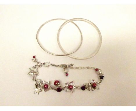 A sterling silver double connected bangle, hallmarked Birmingham and makers mark JEG, and a Danish Pilgrim bracelet in origin