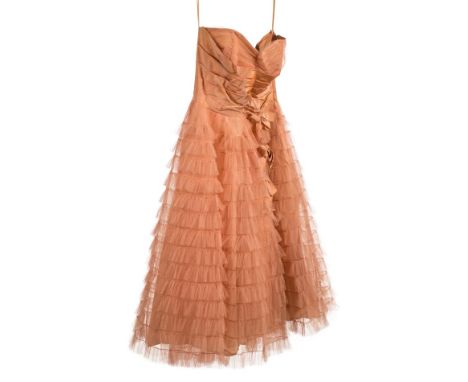 *Dress. A taffeta and net ball gown, early-mid 20th century,  strapless pale peach gown, with boned bodice of ruched net and 