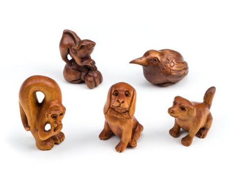 *Netsuke. A collection of five Japanese carved wood netsuke,  comprising a rat standing on a bag, signed, 4.5cm high, a monke