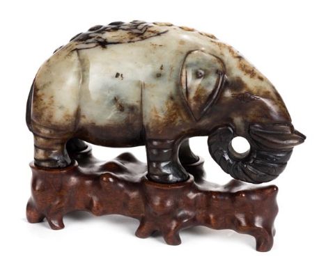 *Jade. A Chinese jade carving of an elephant, probably early 20th century,  carved in an archaic style with squat legs and cu