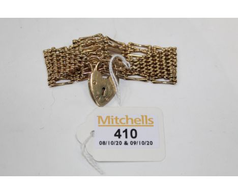 9 ct gold gate bracelet, weight +/- 26.5 grams 