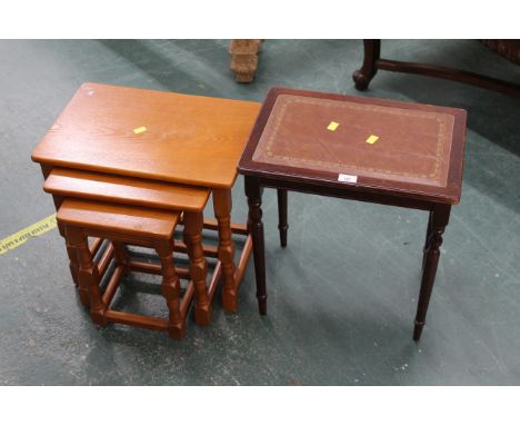 Nest of three light coloured tables and a leather topped occasional table 