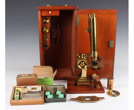 A Victorian lacquered brass binocular microscope, signed 'J. Rowley &amp; Son Makers Brighton', with eyepiece focusing, rack 