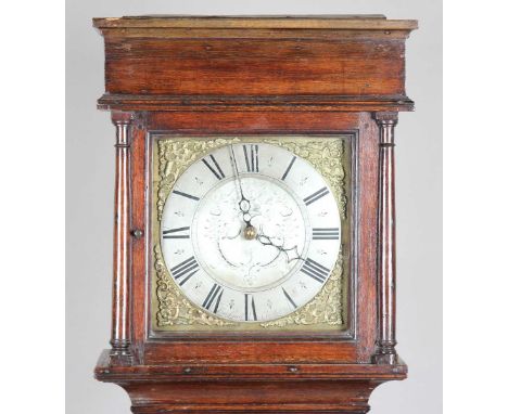 A George III oak longcase clock with thirty hour movement striking on a bell via an outside countwheel, the 11-inch square br