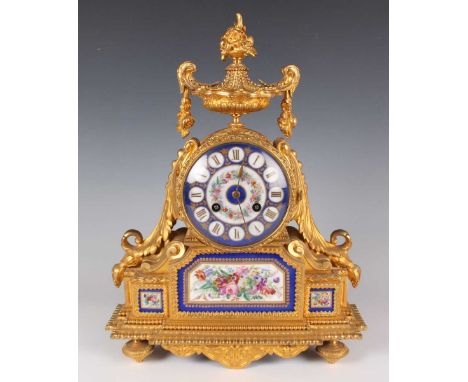 A late 19th century French ormolu and porcelain mantel clock with eight day movement striking on a bell, the backplate inscri