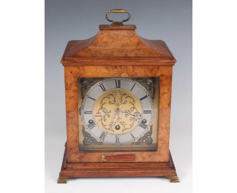 A mid-20th century walnut mantel clock, the eight day movement with platform escapement and chiming on five gongs, the square