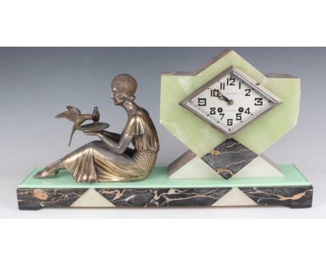 An Art Deco marble, onyx, glass and spelter figural mantel clock with eight day movement striking on a bell via an outside co