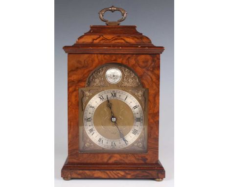 A mid to late 20th century walnut cased mantel timepiece, the brass breakarch dial with silvered 'Tempus Fugit' boss to arch 