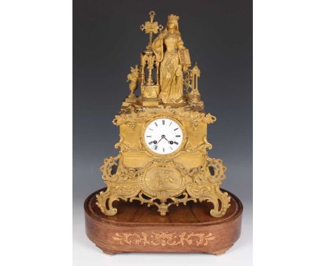 An early 19th century French ormolu cased mantel clock, the eight day movement with silk suspension striking on a bell via an