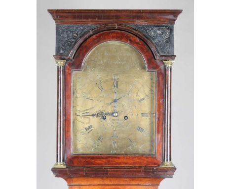 A George III walnut and mahogany longcase clock with eight day movement striking on a bell, the 12-inch brass breakarch dial 