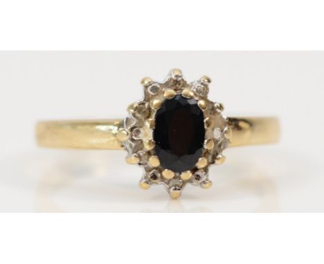A 9ct gold sapphire and diamond cluster ring, N, 2.4g 