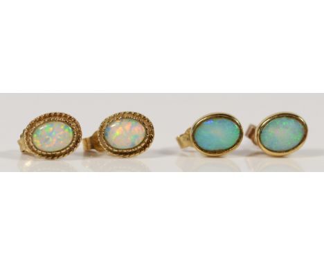 A pair of 9ct gold opal earrings with scroll backs, together with a similar synthetic opal pair, 3g 