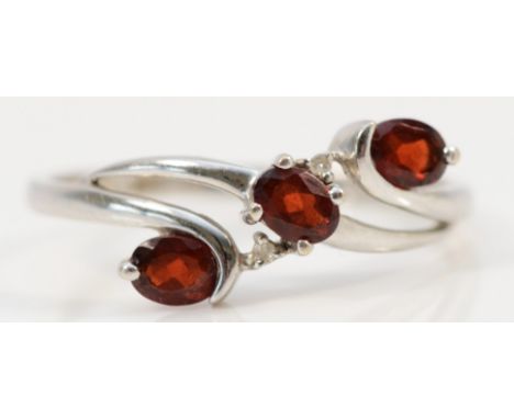 A 9ct white gold garnet and diamond ring, P, 1.5gm 