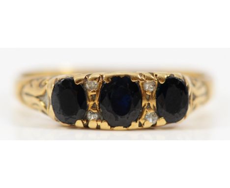 A 9ct gold vintage sapphire and diamond dress ring with patterned gallery, Q, 2.9g 