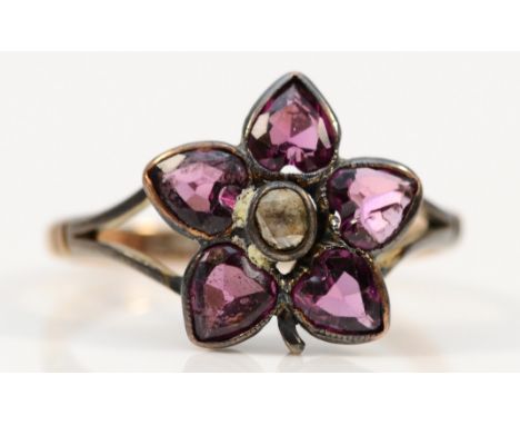 A Victorian 9ct gold flat cut garnet and rose cut diamond cluster ring, M 1/2, 2.4gm 