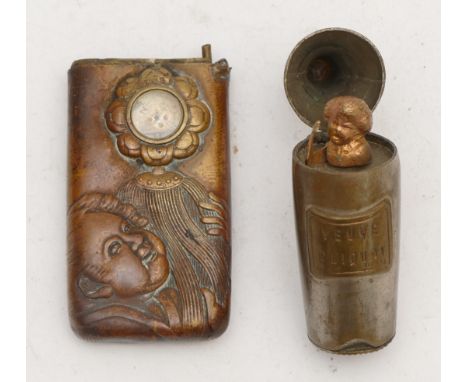 A Japanese brass compass/vesta case, with embossed figures, hinge broken, 6.5cm and a Veuve Cliquot champagne bottle vesta ca