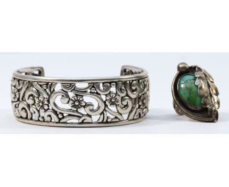 Carolyn Pollock, a Native American cast silver bangle23mm wide and an unsigned Native American silver and turquoise ring, 57g