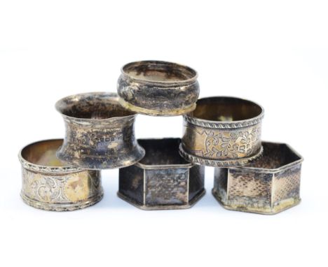 A silver napkin ring, Birmingham 1900, a similar example Birmingham 1913, two other silver examples, 70gm and a pair of elect