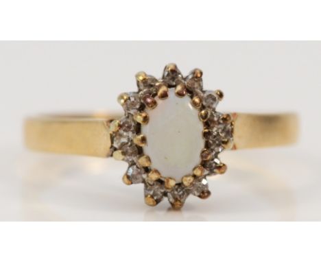 A 9ct gold vintage opal and diamond cluster ring, M, 1.9g 