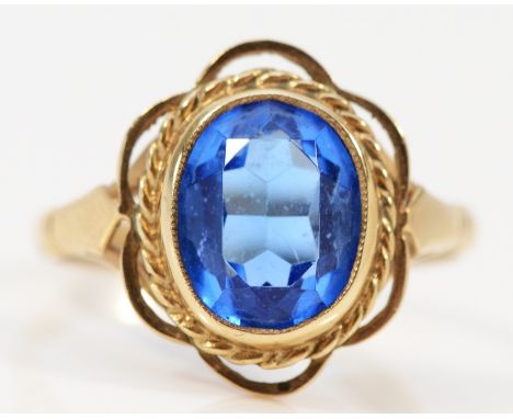 A 9ct gold blue glass dress ring, stone 10 x 8mm, O, 3.1gm 