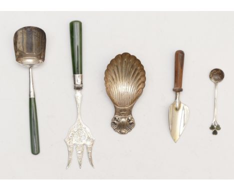 A silver shell bowl caddy spoon, London 1990, a Sterling Silver shovel caddy spoon with nephrite jade handle, and three other