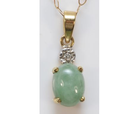 A 9ct gold cabochon cut jade and diamond pendant with chain, 15mm total pendant length, 1.3g 