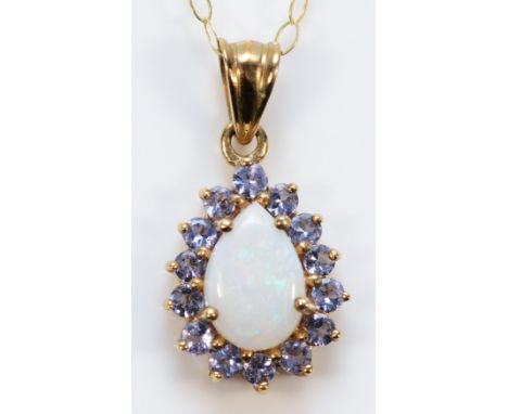 A 9ct gold opal and tanzanite pendant with chain, 12mm pendant, 1.5g 